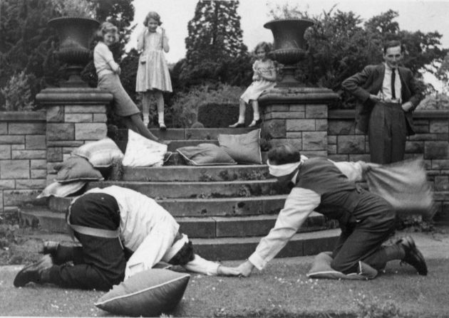 The Honourable Lady Margaret Rhodes is one of the queen's closest relatives and a childhood playmate. She describes in her book, "The Final Curtsey," how the grownups played silly games such as 'Are you there Moriarty?' Two people, blindfolded, lie on the ground with cushions, trying to hit each other when they answer.