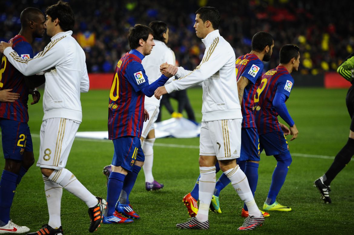 Barcelona's Lionel Messi (left) and Real Madrid's Cristiano Ronaldo (right) -- widely considered the two best players in the world -- shake hands before the 'El Classico' derby between Spain's two biggest clubs. But is the huge wealth of Barca and Real damaging the rest of Spanish football?