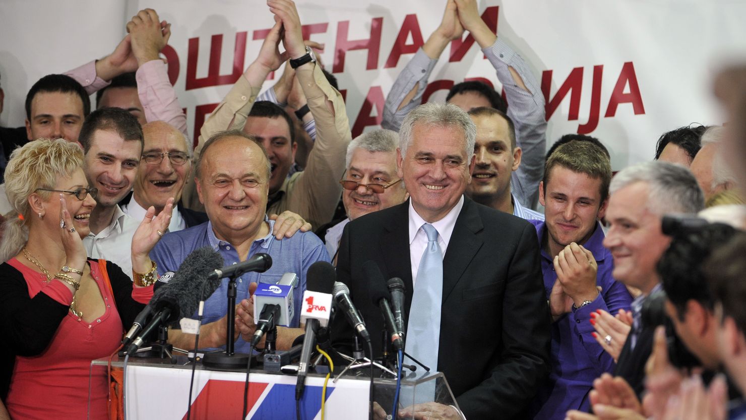 New Serbian President Tomislav Nikolic (C-R) addresses supporters at his party's headquarters in Belgrade on May 20.