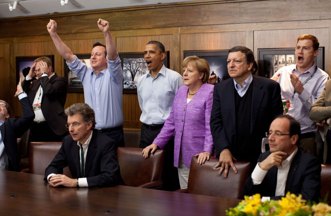 U.S. President Barack Obama watched the action at a G8 summit at Camp David, with British Prime Minister David Cameron to his right and German Chancellor Angela Merkel on his left.