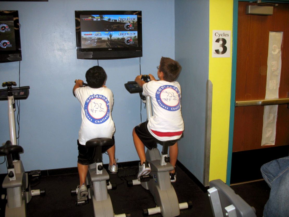 Students at an elementary school in Miami, Flordia, compete in an exer-game on stationary bikes. 
