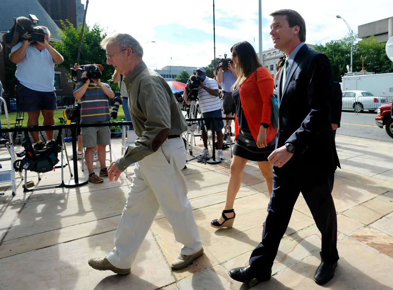 Edwards enters a Greensboro, North Carolina, courthouse for his federal corruption trial with daughter Cate on May 21, 2012. 