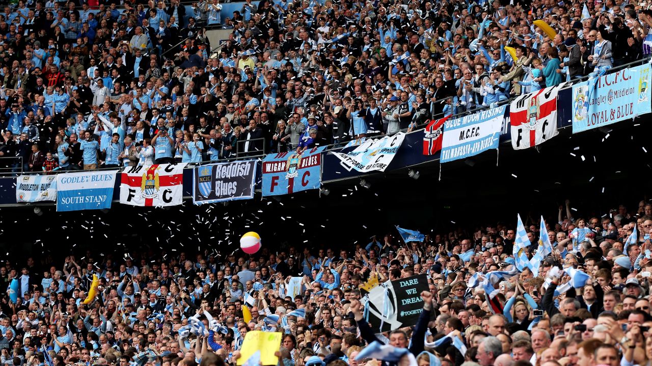 Manchester City fans saw their team clinch a first English top division title in 44 years.