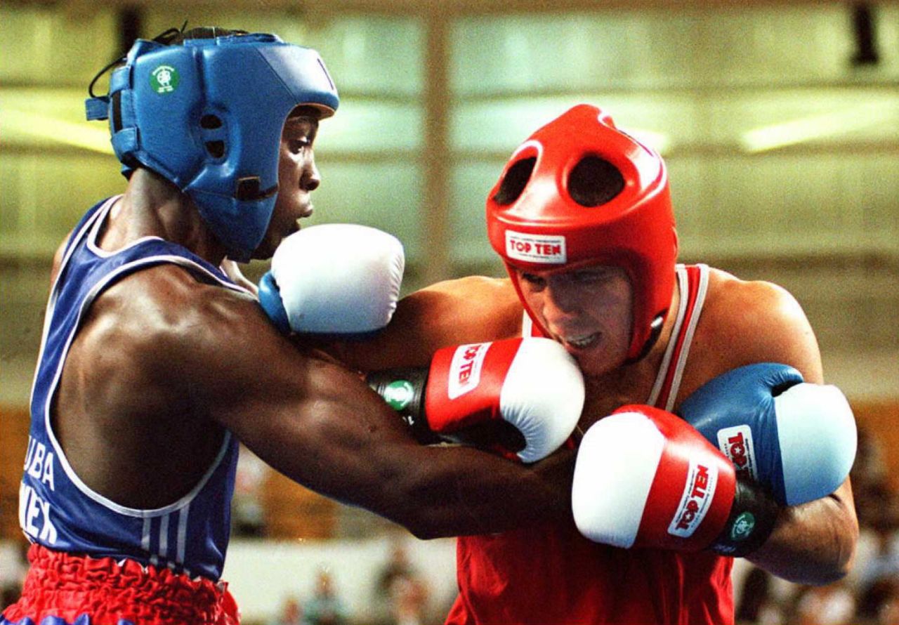Hector Vinent Charon trains the youngsters at the Rafael Trejo boxing gym in Havana. Charon (left) is a two-time Olympic gold medalist, having won the light welterweight at both the 1992 and 1996 Games.