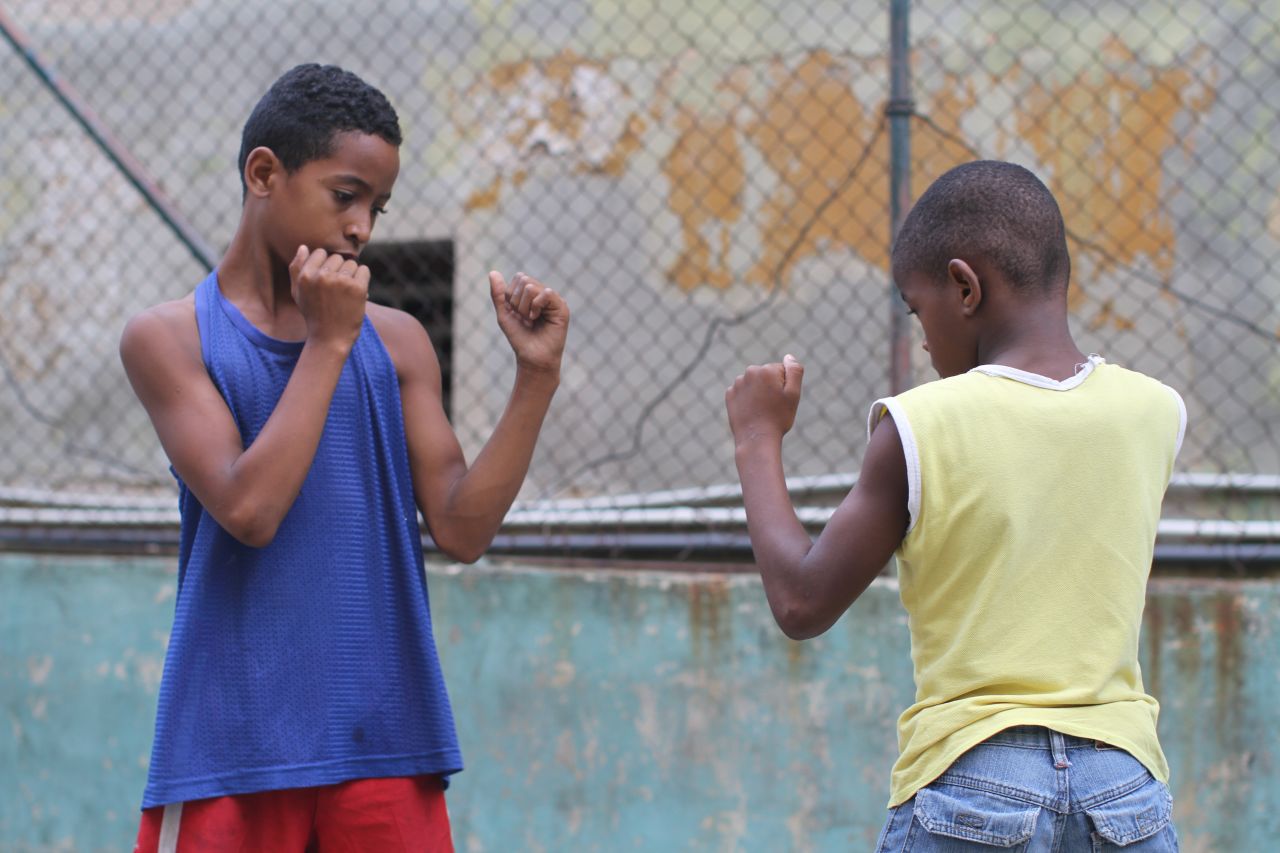 Boys at a Havana gym practice their boxing stance. Boxing, like baseball, is a sport many Cubans are passionate about.