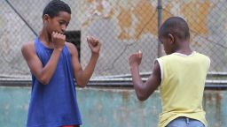 Boys at a Havana gym practice their boxing stance. Boxing, like baseball, is a sport many Cubans are passionate about.