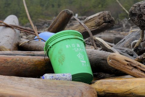 Japanese writing marks the side of a green bucket found on Montague Island. 
