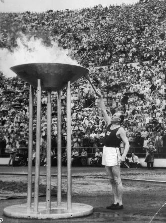 Finnish runner Paavo Nurmi lights the cauldron at the 1952 Helsinki Olympics. It was the first time the flame had been transported by plane. Since then it has been transformed into a radio signal for the 1976 Montreal Olympics and carried underwater by divers during the 2000 Sydney Games.