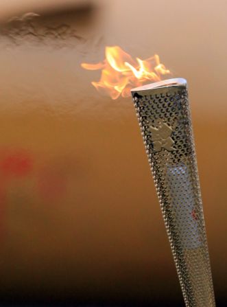 London designers Edward Barber and Jay Osgerby beat around 600 agencies to create the 2012 torch. It features 8,000 holes, made with lasers, representing the number of torchbearers.