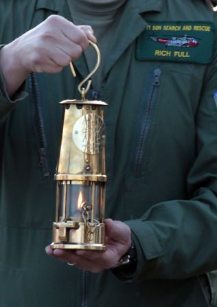 Lieutenant Commander Richie Full delivers the Olympic flame at Land's End. Just two days later, on May 21, the torch went out as para-badmington star David Follett carried it through Devon. It was relit using a back-up flame with Games chiefs admitting it was not uncommon for the torch to go out.