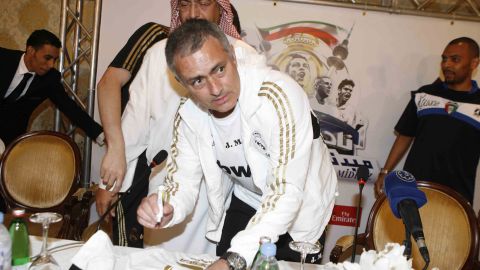 Jose Mourinho signs autographs during Real Madrid's postseason trip to Kuwait on May 15.