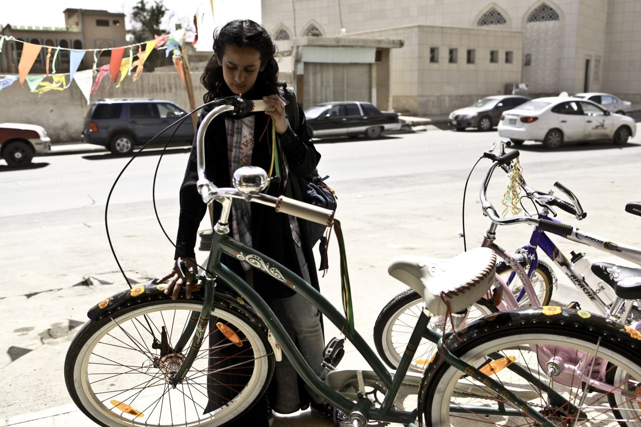 Director Haifaa Al Mansour says that when filming outdoor scenes, she has to direct from inside a van and communicate with actors via a walkie-talkie.