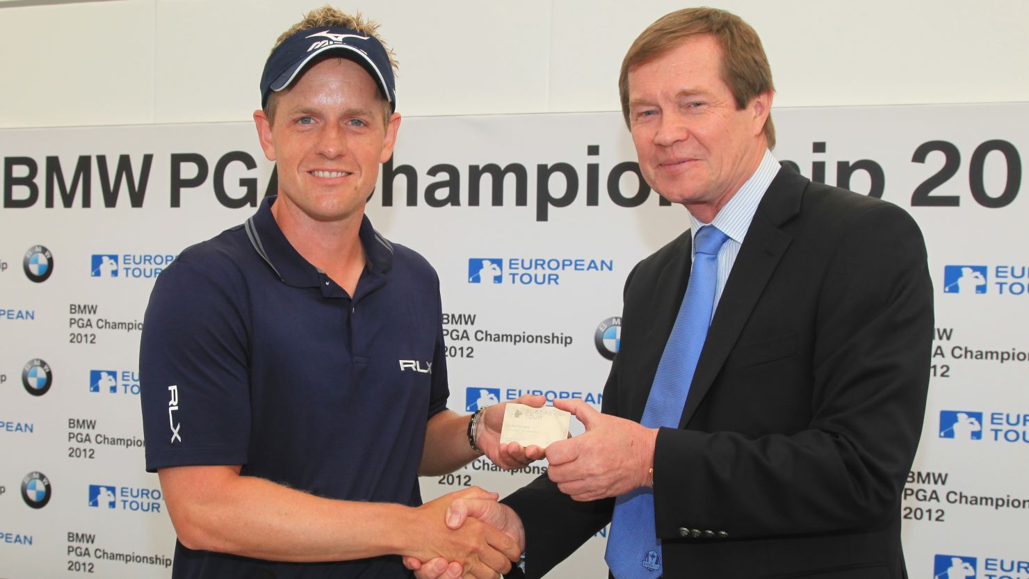 Luke Donald (L) receives his honorary life membership from European Tour chief exec George O'Grady 