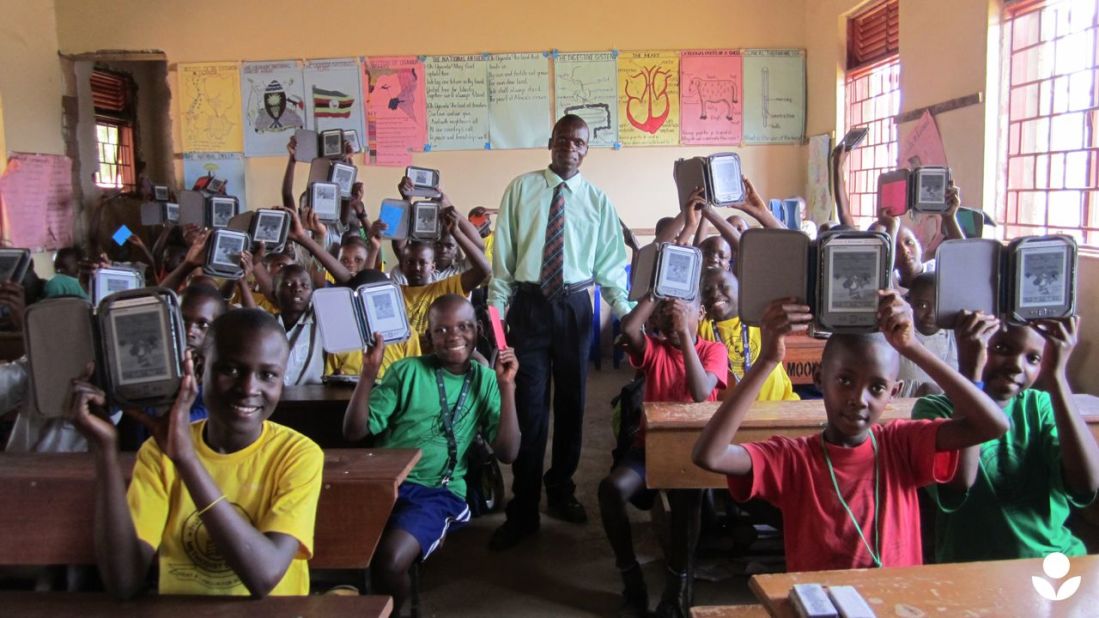 Students and their teacher at Humble School in Mukono, Uganda. E-readers are considered an effective approach to encouraging literacy in parts of the developing world where traditional books are scarce, because they give students direct access to a greater number of titles.