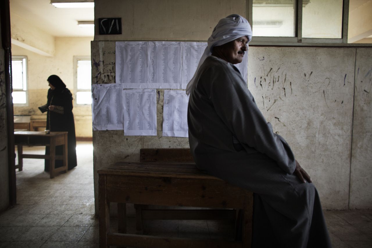 An Egyptian man waits to cast his ballot Thursday north of Cairo. The vote is considered Egypt's first free and fair presidential election in modern history.
