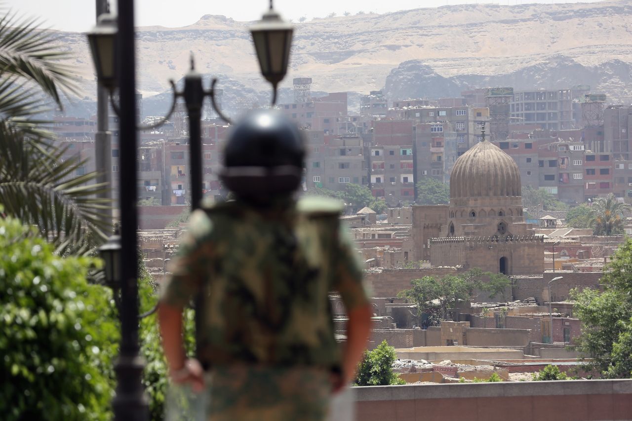 A soldier stands watch in the Egyptian capital on the second day of voting. A pervasive fear exists that the powerful military, which has run the country since Mubarak's fall 16 months ago, could try to hijack the election.