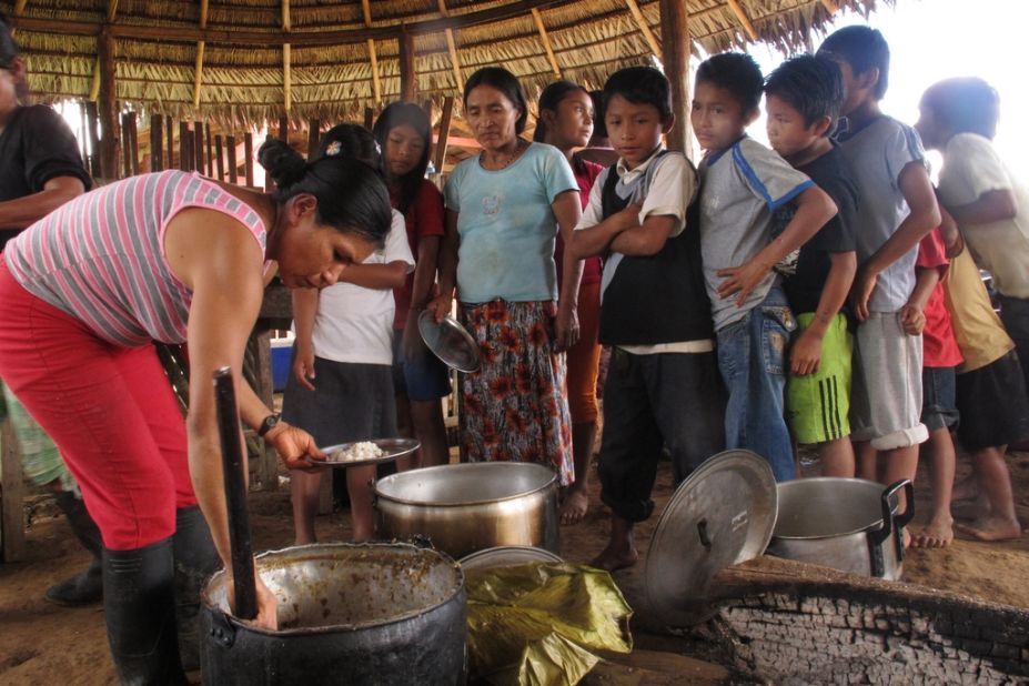 Communal lunch being served in the Sarayaku community, Ecuador, in July 2011. 