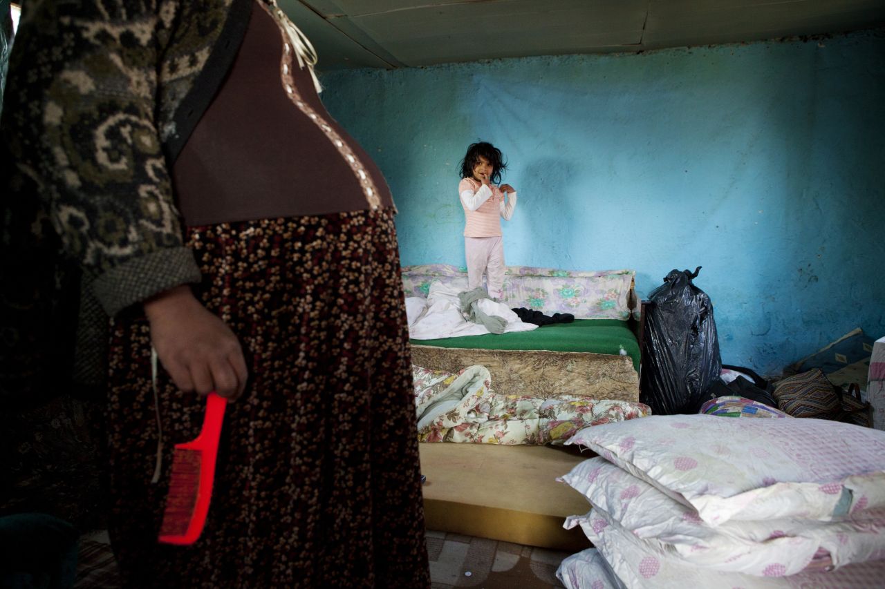 A pregnat mother and her daughter at home before the forced eviction of an informal Roma settlement in Belgrade. The Belgrade city authorities, on behalf of the government of Serbia, authorised the eviction to make way for commercial housing on the government-owned land.