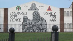 The Northern Ireland peace process was signed in 1998 but paramilitary murals -- this one for the Ulster Volunteer Force -- still cover Belfast walls.