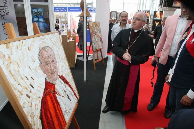 Apostolic Nuncio to Poland Archbishop Celstino Migliore gets a grand tour of the reliquaries and kitsch on show at last year's expo.