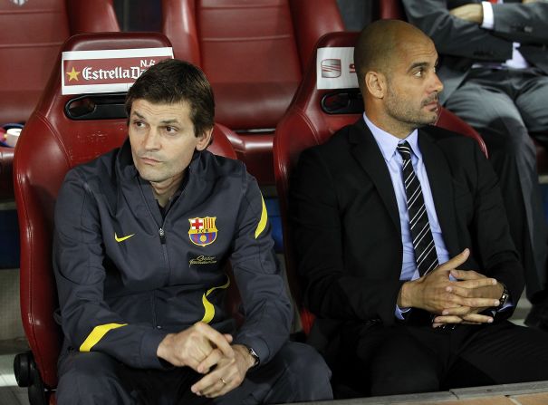 Pepe Guardiola and his successor Tito Vilanova sit in the dug out during the Copa del Rey final win.