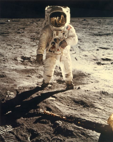 Astronaut Neil Armstrong is seen in the reflection of Edwin 'Buzz' Aldrin's helmet during the pair's historic walk on the surface of the moon on July 20, 1969.