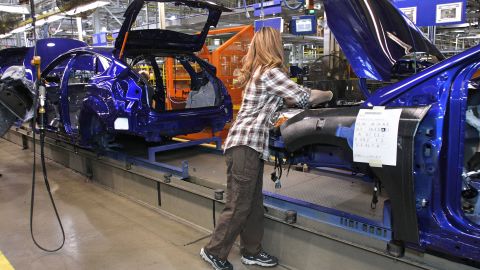 A worker builds a Ford Focus at the Ford Motor Co.'s Michigan Assembly Plant December 14, 2011 in Wayne, Michigan.