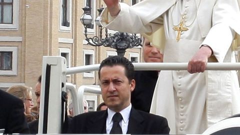 Paolo Gabriele rides in the pope mobile with Pope Benedict XVI in St. Peter's Square in March 2011