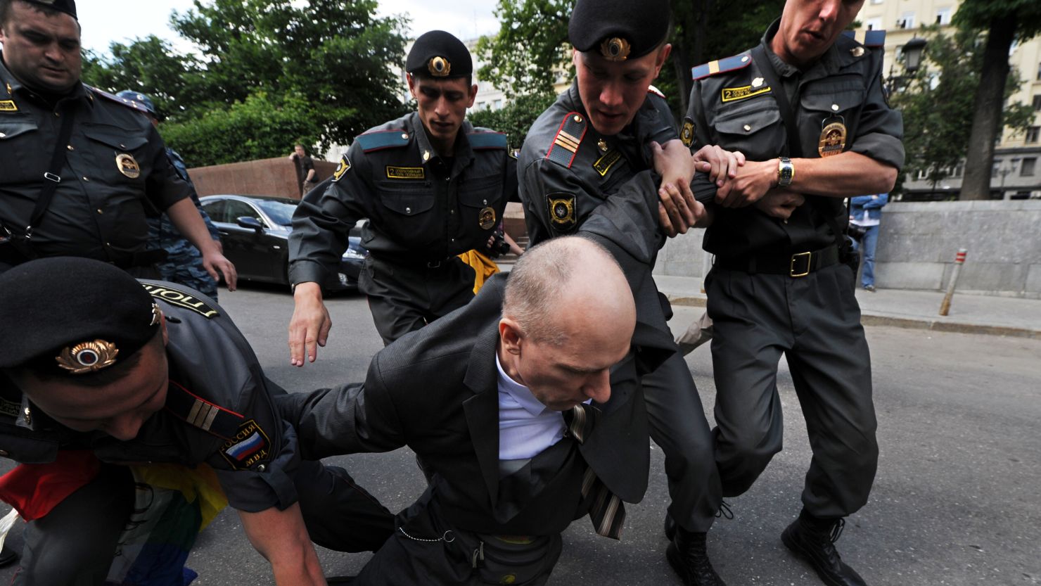 Russian police detain a man during a rally for gay rights in Moscow.
