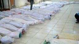 Bodies lie in a hospital morgue before their burial in the central Syrian town of Houla on Saturday.