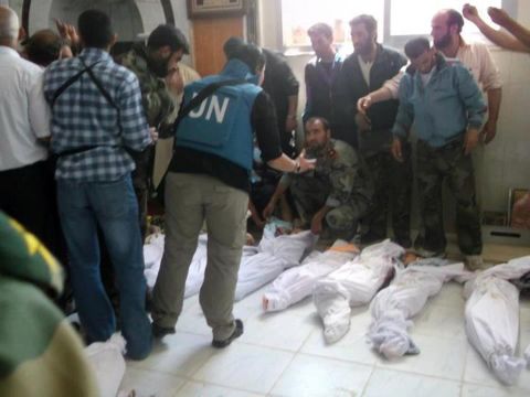 U.N. observers visit a hospital morgue in Houla on Saturday before the burial of massacre victims. Opposition activists and residents blame al-Assad's regime for the bloodbath.