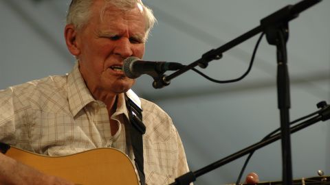 Guitarist and singer Doc Watson performs at the New Orleans Jazz and Heritage Festival. 