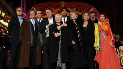  "Hotel Marigold" actors Bill Nighy, from left, Ronald Pickup, producer Graham Broadbent, director John Madden, actors Judi Dench, Dev Patel, Diana Hardcastle, Penelope Wilton, Tom Wilkinson and Celia Imrie at the premiere of their film in London.