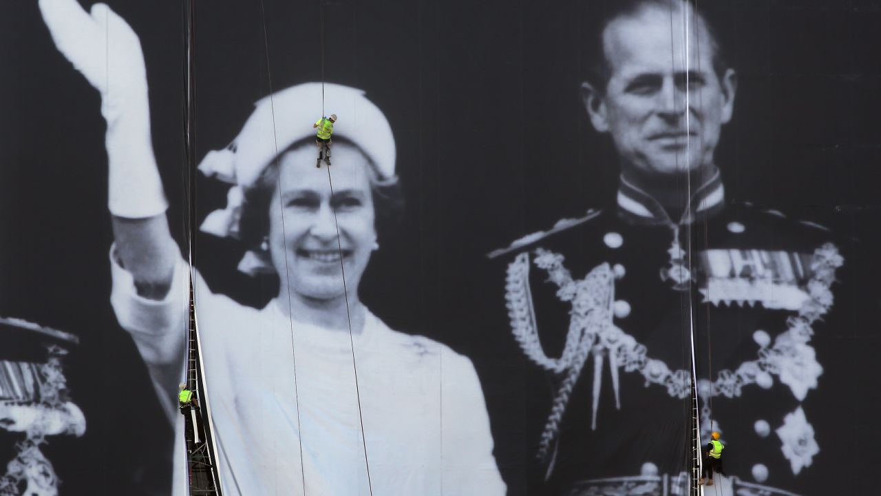 A giant photograph of Queen Elizabeth II and The Duke of Edinburgh is erected on a building on The River Thames on May 25.