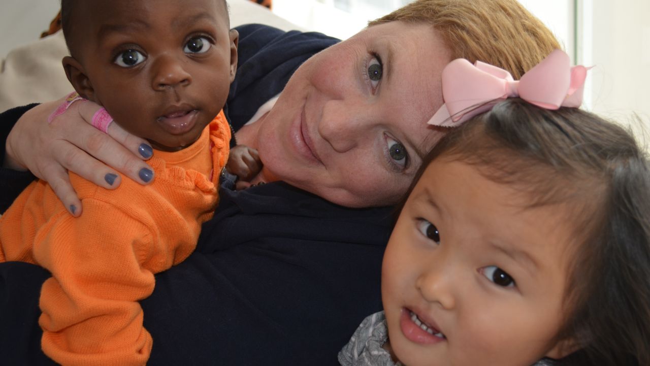 Karen Brown with her two adopted children, one-year-old Nyla from Rwanda and four-year-old Makena from China.