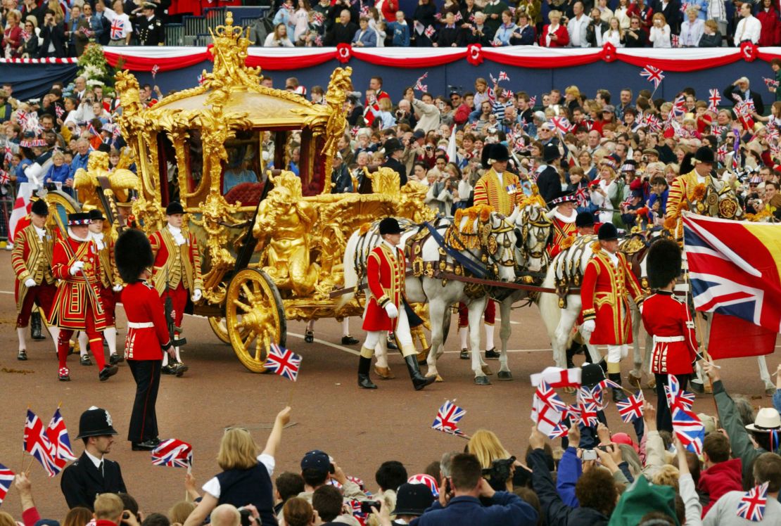Queen Elizabeth and Prince Philip ride in the Golden State Carriage at the head of a parade along The Mall in London celebrating the Queen's golden jubilee on June 4, 2002 . 