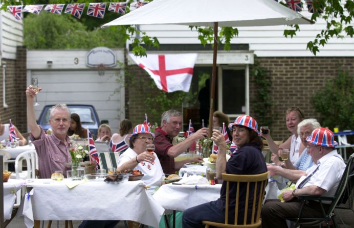 Neighbors mark the Golden Jubilee during one of the numerous street parties held across the United Kingdom in June 2002. More of the same are expected during the Diamond Jubilee celebrations.