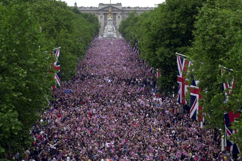 Crowds fill The Mall in central London to watch a flypast after a parade as part of the Golden Jubilee celebrations for Elizabeth II. 