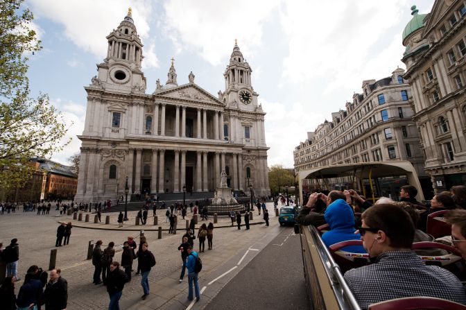 Tourists admire the view of Saint Paul's Cathedral from an open-top bus. The queen will visit the church on the morning of June 5 for the national Service of Thanksgiving before the procession and flypast at Buckingham Palace.