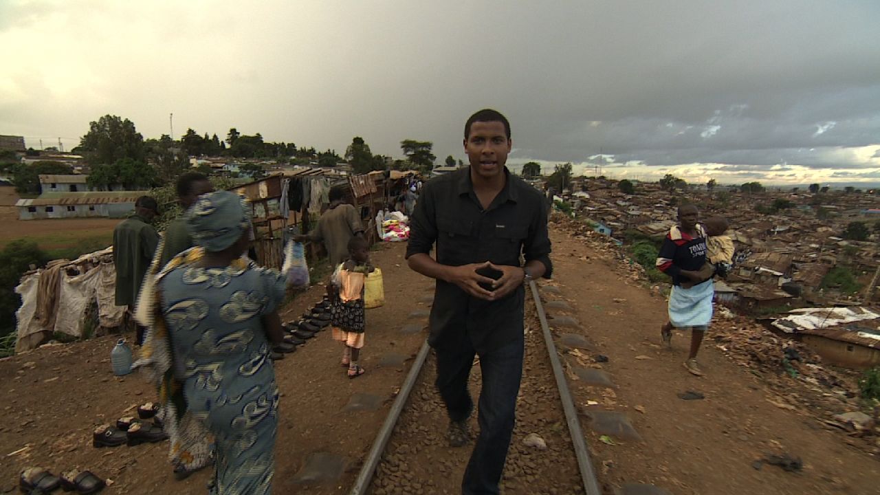 CNN's Errol Barnett walks the train tracks that run through the middle of Kibera, one of Africa's largest slums.