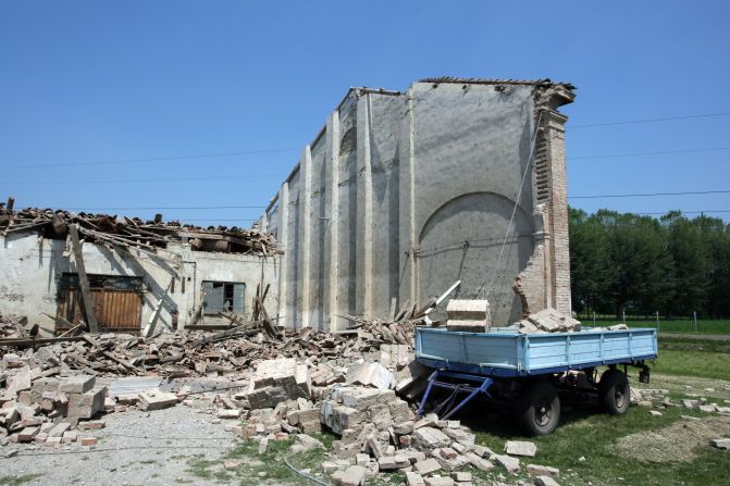 A building's roof collapsed after the earthquake in Cavezzo, Italy, where eyewitnesses say about 70% of the town was destroyed.