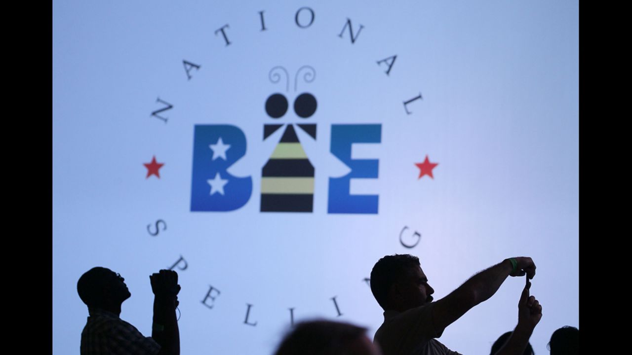 Spectators photograph the contestants during the third round of the 2012 Scripps National Spelling Bee in National Harbor, Maryland, on Wednesday, May 30.