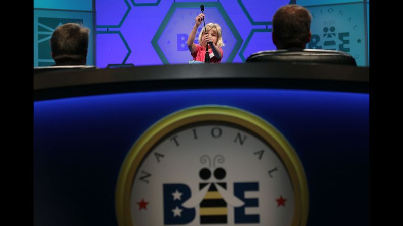 Lori Anne Madison adjusts the microphone before spelling a word Wednesday. She failed to make it to the finals of the annual competition.