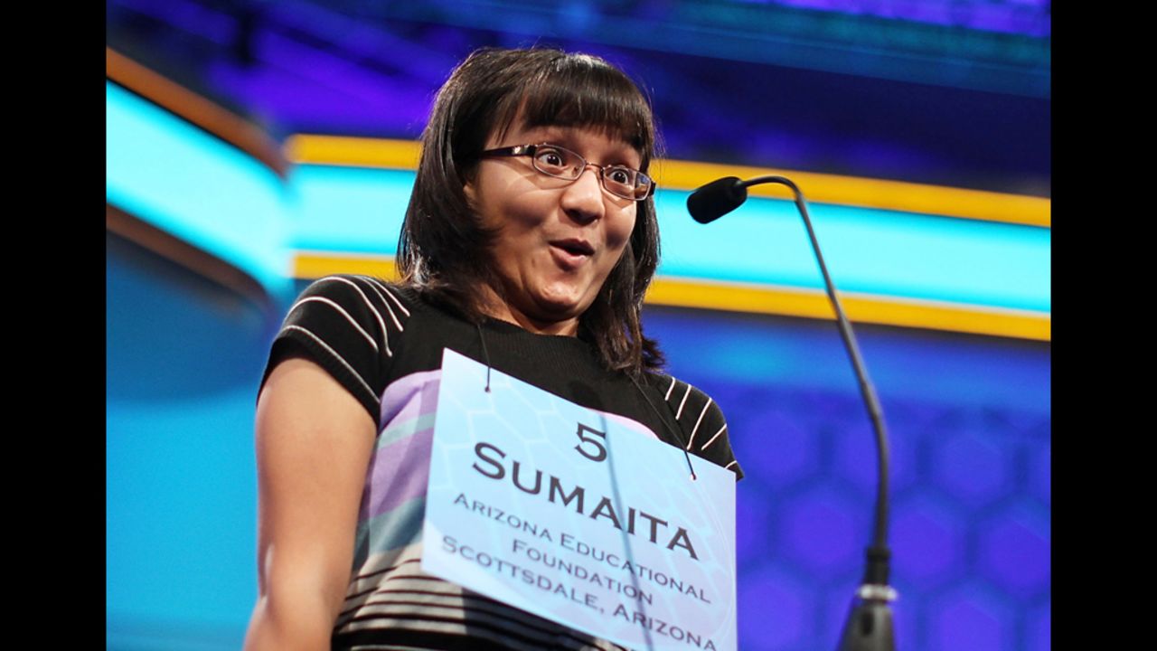 Sumaita Mulk of Goodyear, Arizona, celebrates on Thursday, May 31, at the Scripps National Spelling Bee after she correctly spelled her word during the fourth round. Fifty spellers advanced to compete in the semifinals on the last day of the competition.