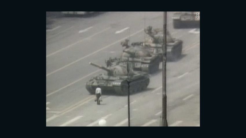 In this iconic image, an anonymous "tank man" stands in protest in front of a column of Chinese tanks on June 5, 1989.