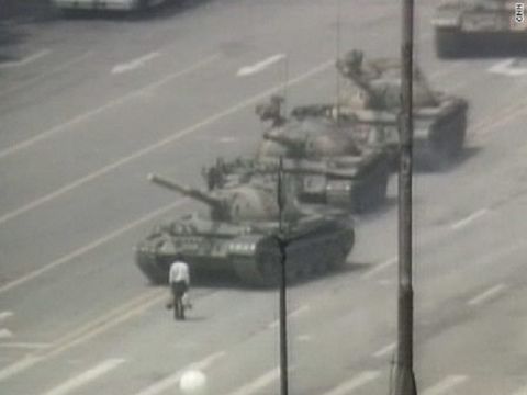 A lone man stands in protest in front of a column of Chinese tanks on June 5, 1989, the morning after the massacre of pro-democracy protesers in Tiananmen Square. The "tank man" became famous around the world.
