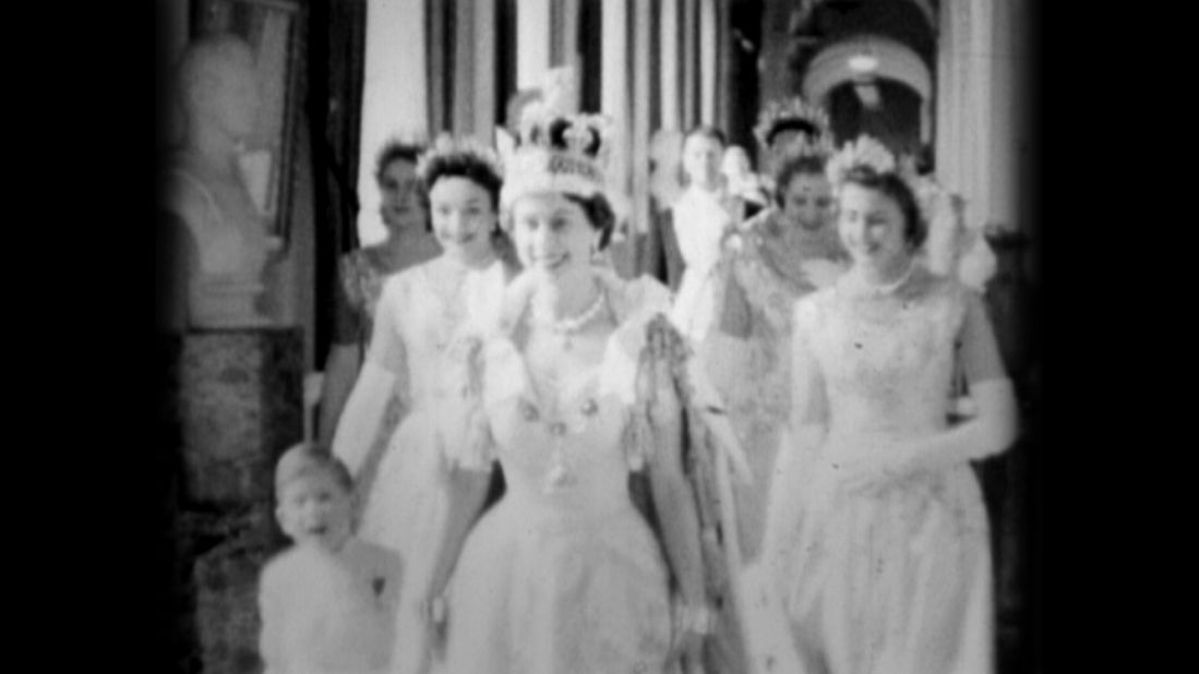 The Queen in the Principal Corridor at Buckingham Palace on Coronation Day, 2nd June 1953, accompanied by Prince Charles.