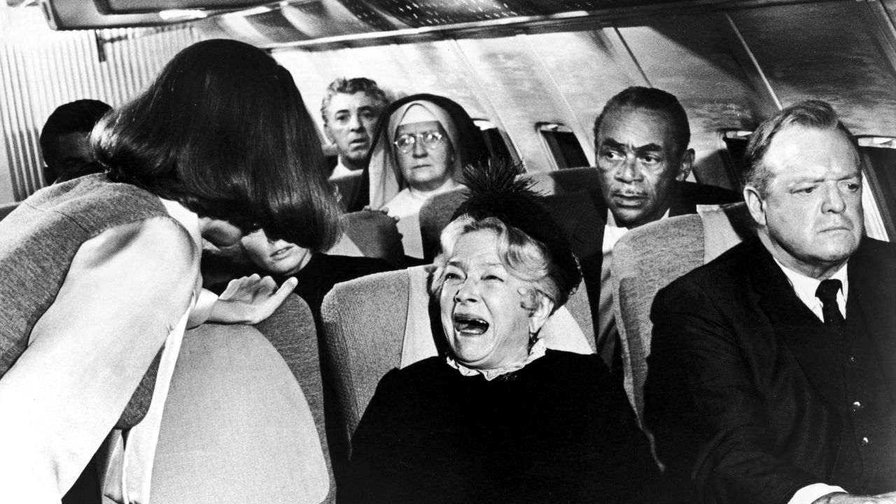 In the 1970 movie "Airport," a flight attendant tries to calm a hysterical passenger (played by actress Helen Hayes).