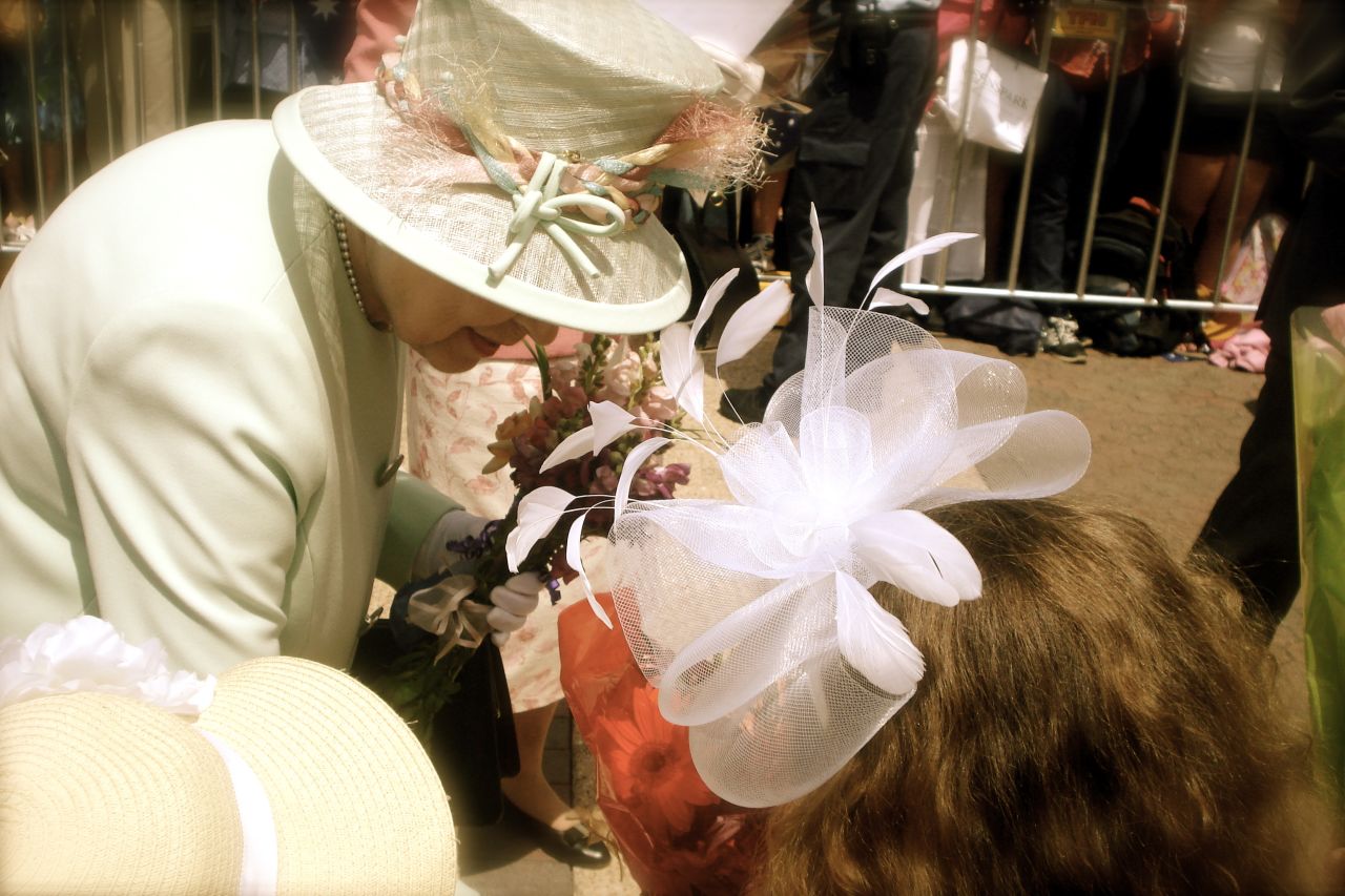 Queen Elizabeth II accepts a bouquet from nine-year-old Tatum Botha, October 24, 2011. Tatum's mom Chaleen says the meeting was a dream come true for her daughter. "The Queen said, 'Thank you.' Tatum replied, 'It's a pleasure.'"