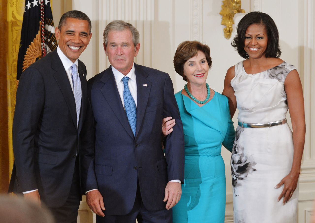 Bush also joked with Michelle Obama. "Dolley Madison famously saved this portrait of the first George W.," Bush told the laughing crowd. "Now Michelle, if anything happens, there's your man," he continued, pointing to his new portrait.